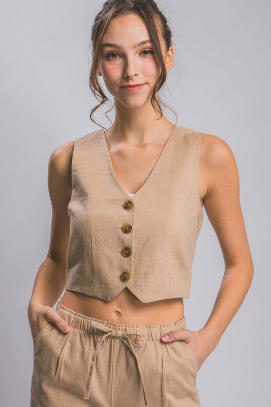 Model is wearing Khaki Linen Buttoned Vest Top with matching pants