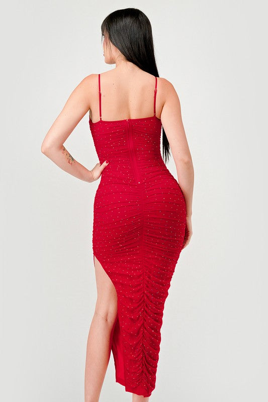 STYLED BY ALX COUTURE MIAMI BOUTIQUE Model is wearing Red Luxe Rhinestone Mesh Ruched Slited Midi Dress back view 
