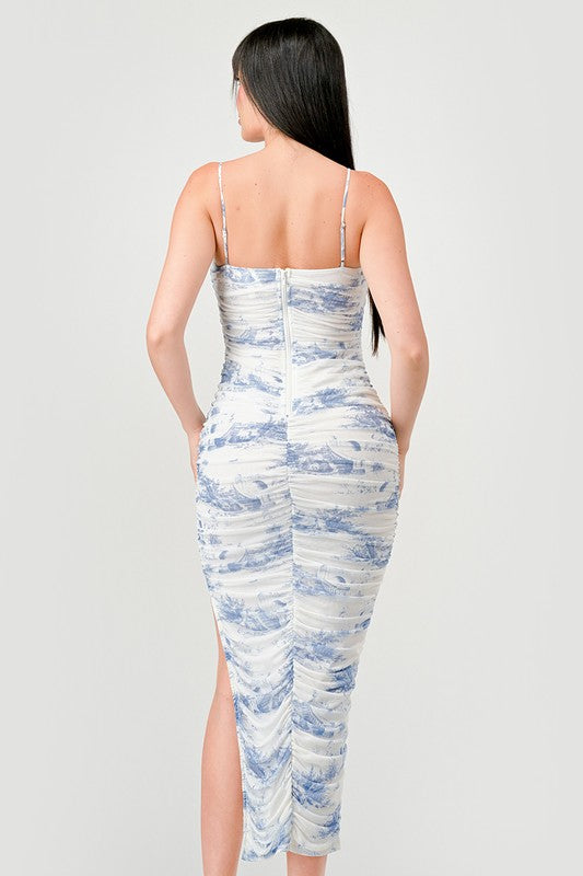 STYLED BY ALX COUTURE MIAMI BOUTIQUE Model is wearing Ivory Blue Luxe Landscape Mesh Print Ruched Midi Dress back view 