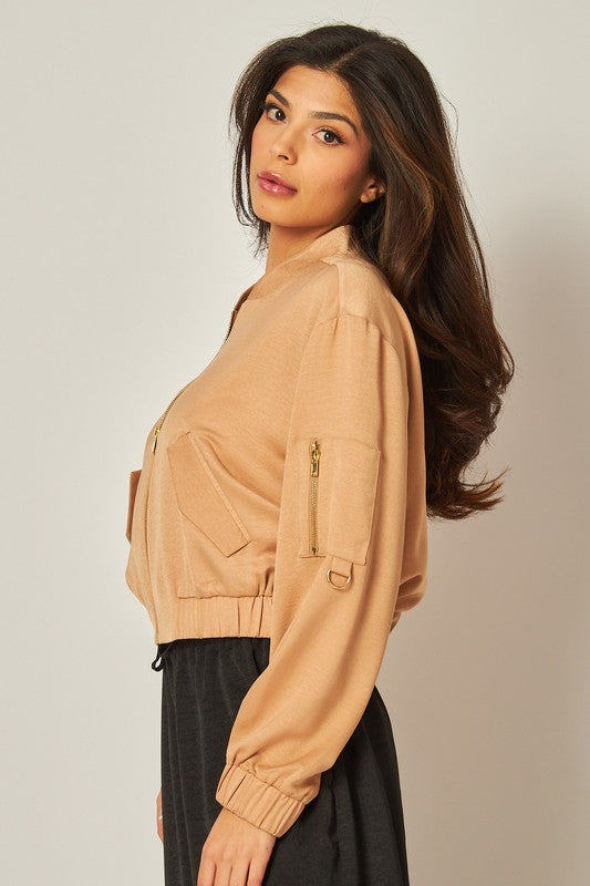 model is wearing Black Satin Bomber Jacket showing the sleeve detail and wearing a black pant