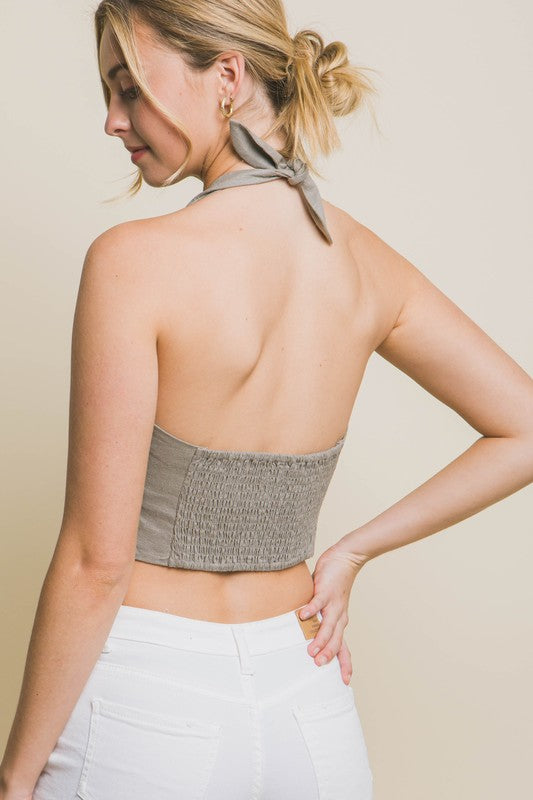 model is wearing Greystone Linen Cropped Vest, back view 