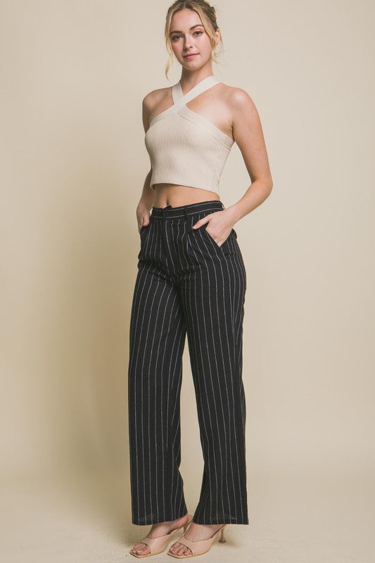 model is wearing Black Linen Stripe Flannel Pants with a beige halter top and beige heel sandals 