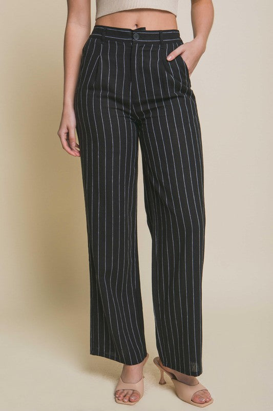 model is wearing Black Linen Stripe Flannel Pants with beige heels 