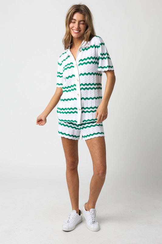 model is wearing White Green Megan Shorts  with matching shirt and white sneakers
