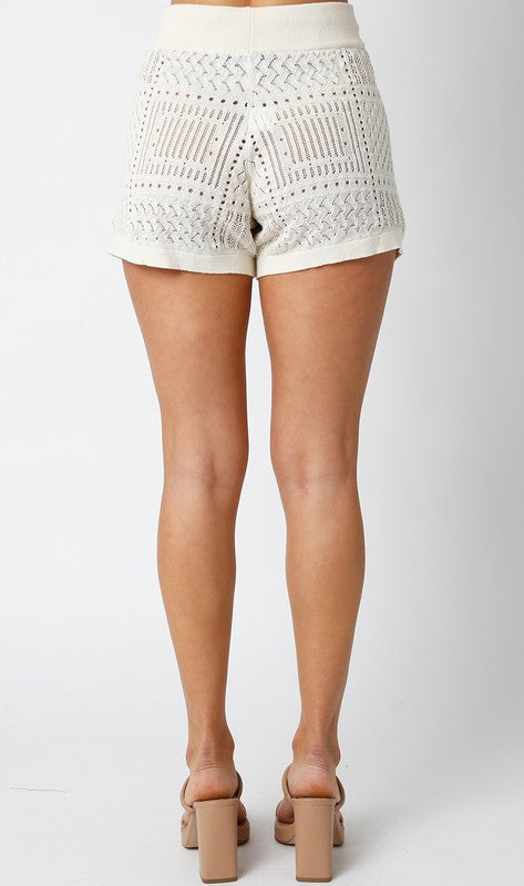 back of the Natural Bonnie Shorts with beige sandals