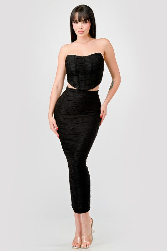 STYLED BY ALX COUTURE MIAMI BOUTIQUE Model is wearing Black Luxe Texture Knit Bustier & Maxi Skirt Set with high heels