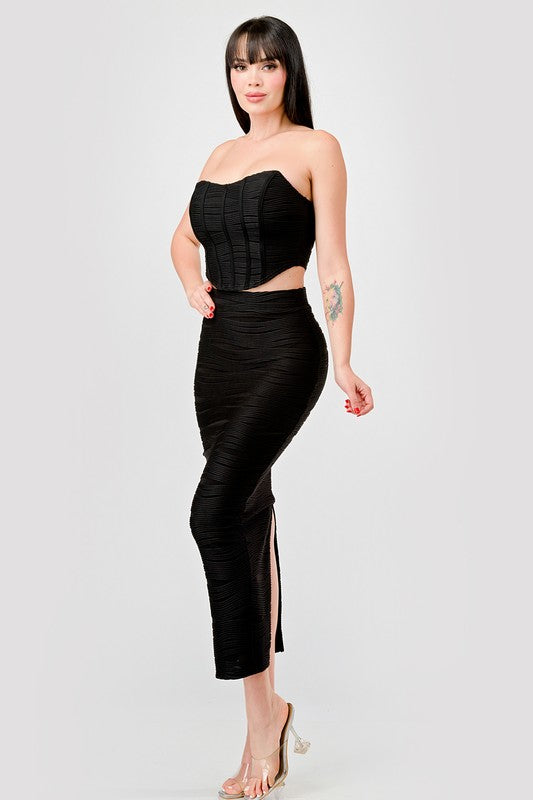 STYLED BY ALX COUTURE MIAMI BOUTIQUE Model is wearing Black Luxe Texture Knit Bustier & Maxi Skirt Set side view