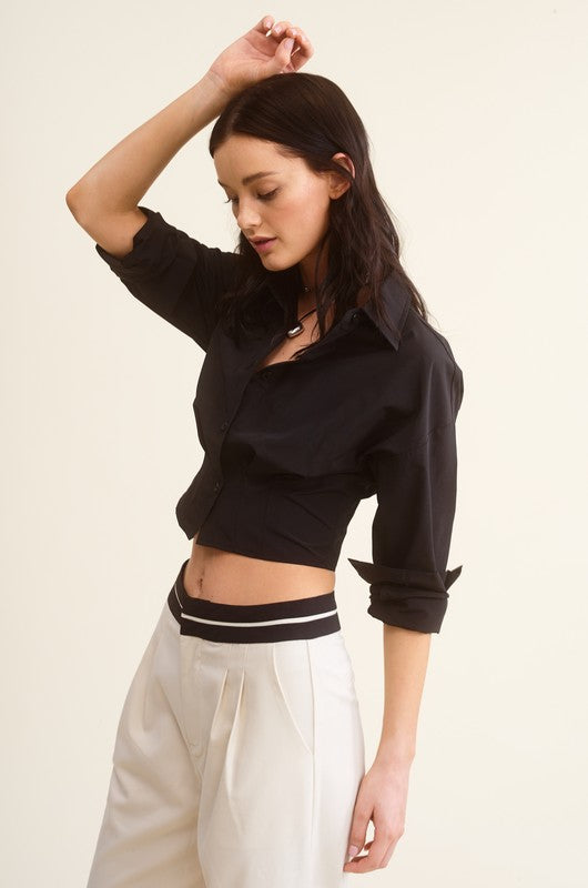 model is wearing Black Giselle Shirt with white pants