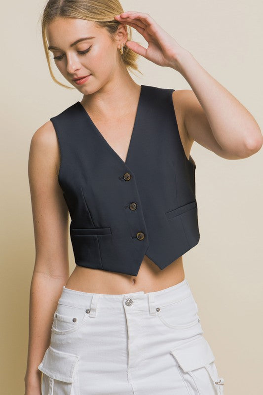 model is wearing Black Cropped Blazer Vest and white cargo 