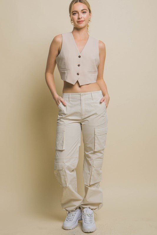 model is wearing Beige Cropped Blazer Vest  with beige cargo pants and white sneakers