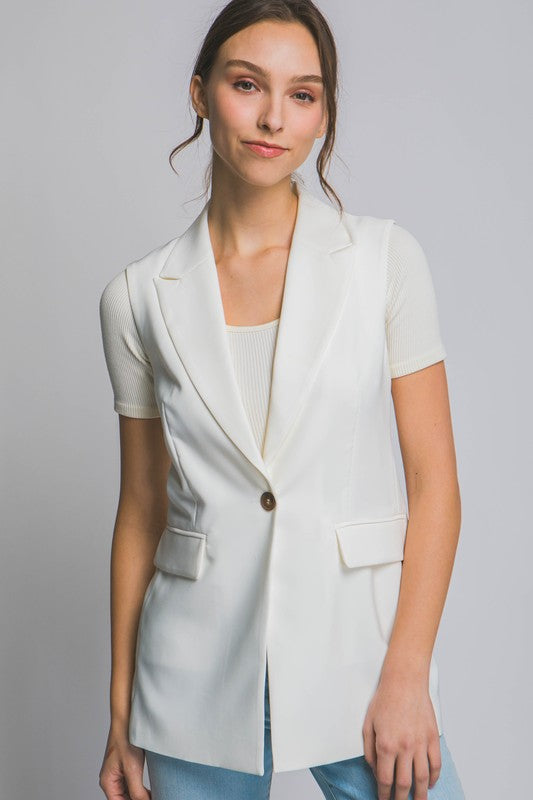 model is wearing White Sleeveless Vertigo Vest Blazer 