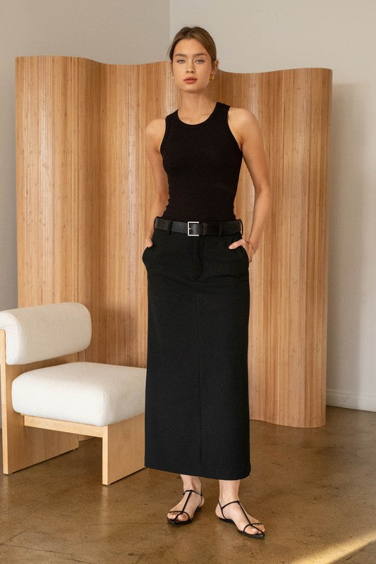 model is wearing Black Washed Seamless Crop Top  with a black maxi denim skirt and black sandals