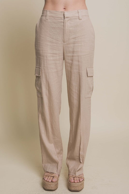 Model is wearing Khaki Linen Cargo Pants  and beige wedges 