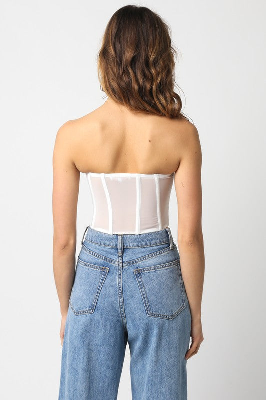 back of the White Zara Top and denim jeans
