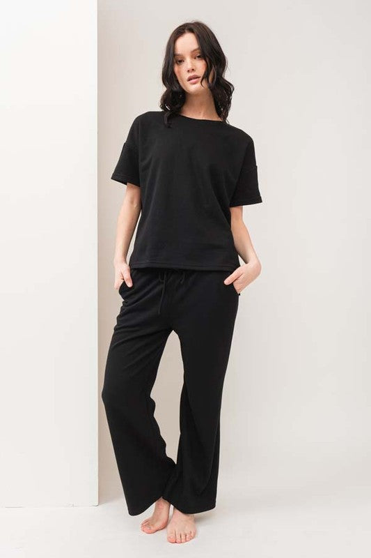 model is wearing Black Thick Travel Pant Set 