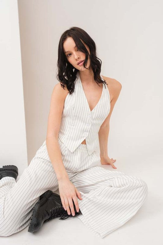 model is wearing White Stripe Vest Pants Set and black boots