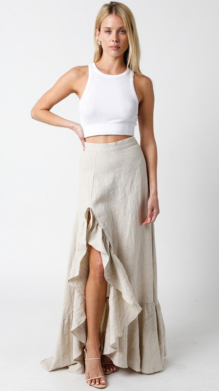 model is wearing model is wearing Melange Giselle Linen Maxi Skirt and beige skirt and white top and beige heels 