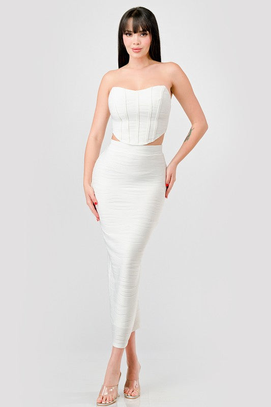 model is wearing White Luxe Texture Knit Bustier & Maxi Skirt Set with heels 