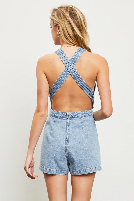 model is wearing Washed Denim Open Back Romper, back view of the romper 