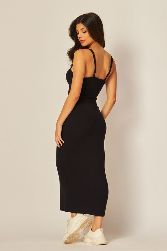 model is wearing Black Adjustable Strap Maxi Dress with white sneakers, back view of the dress