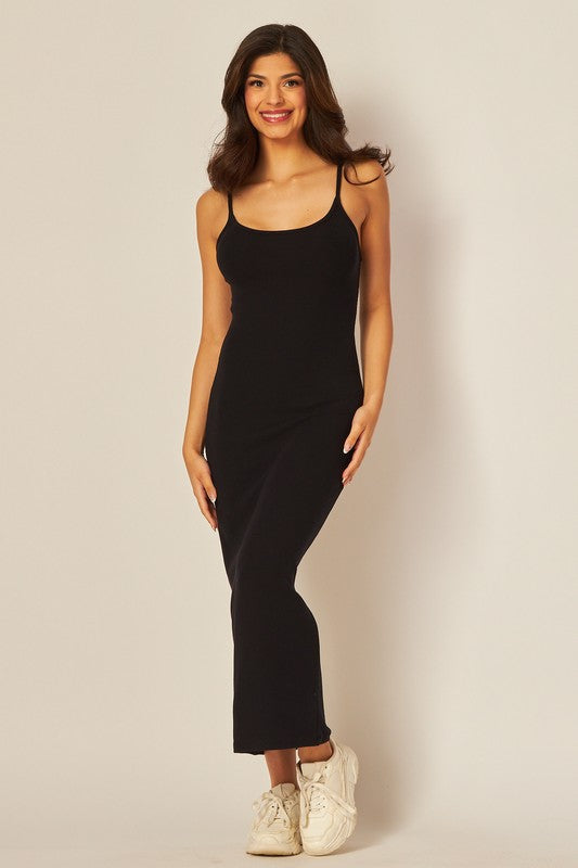model is wearing Black Adjustable Strap Maxi Dress with white sneakers