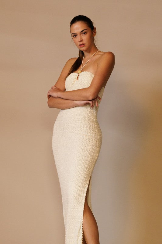 model is wearing Cream Textured Halter Maxi Dress