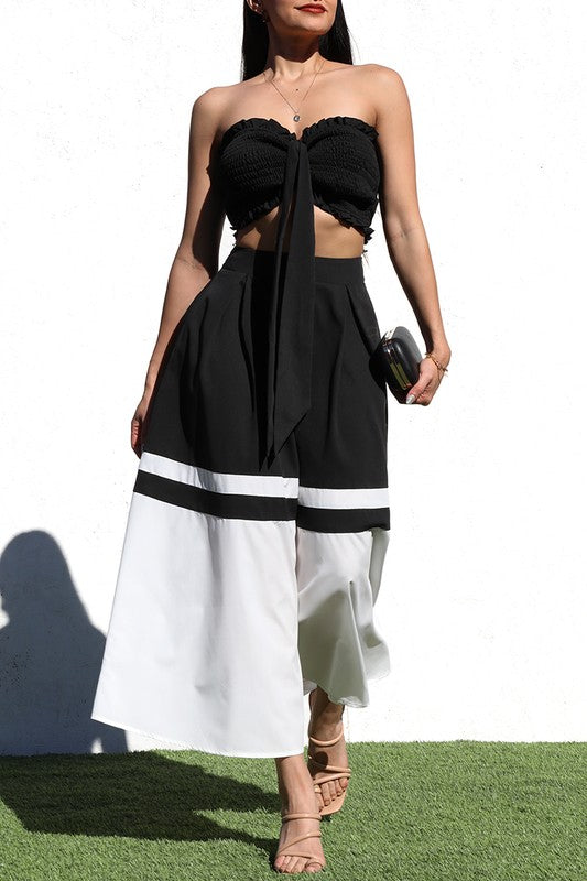 model is wearing Black Smocked Skirt Set