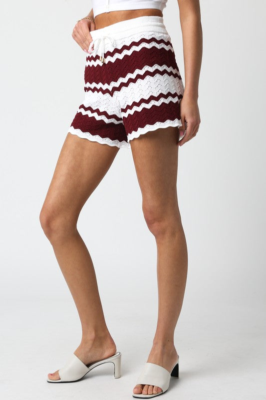side of the Ivory Crimson Brielle Shorts with white sandals 