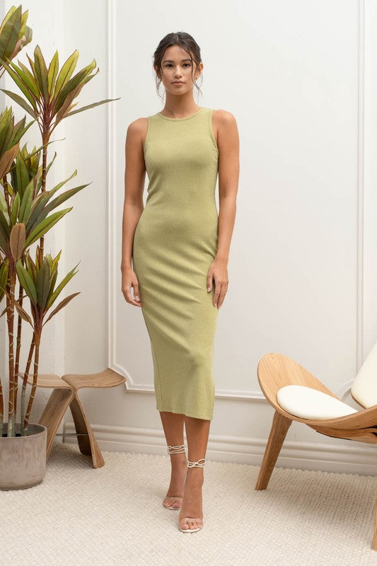 model is wearing Olive Side Slit Round Neck Midi Dress with gold lace up heels 