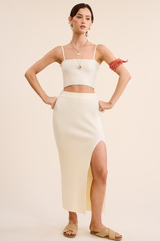 model is wearing Ivory Haddy Skirt Set with beige slide sandals 