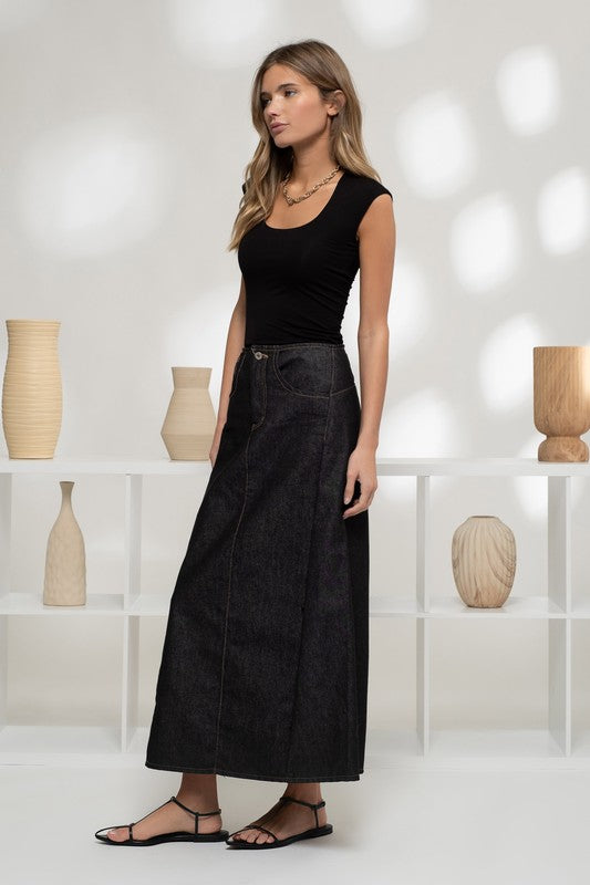 model is wearing Black Reversible Knit Sleeveless Crop Top with dark denim maxi skirt 