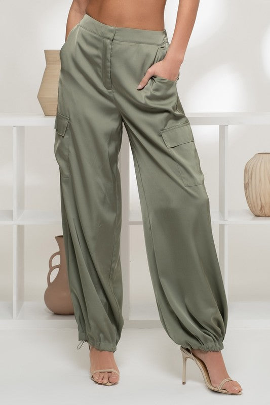 model is wearing Olive Satin Cargo Jogger Pants with beige heels