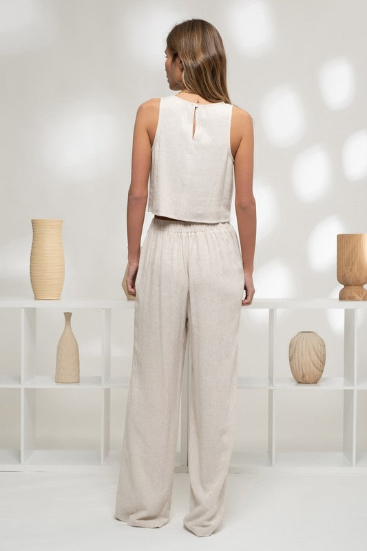 back of the model wearing Oatmeal Wide Leg Pants and matching top 
