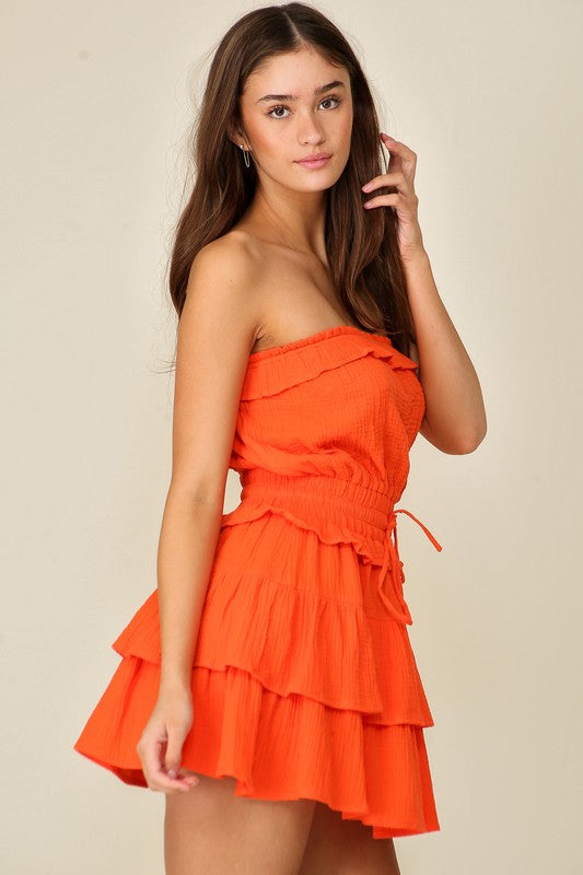 model is wearing Orange Gauze Tiered Game Day Dress 