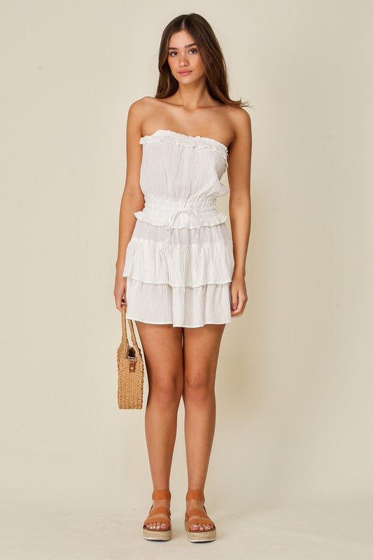 model is wearing White Gauze Tiered Game Day Dress with beige platform sandals