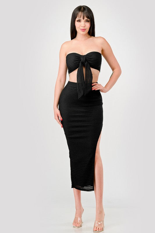 model is wearing Black Fishnet Textured Bow Tie Skirt Set