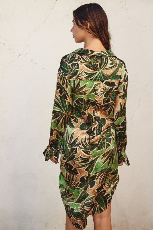 model is wearing Green Tropical Tie Shirt Dress showing the back side of the dress