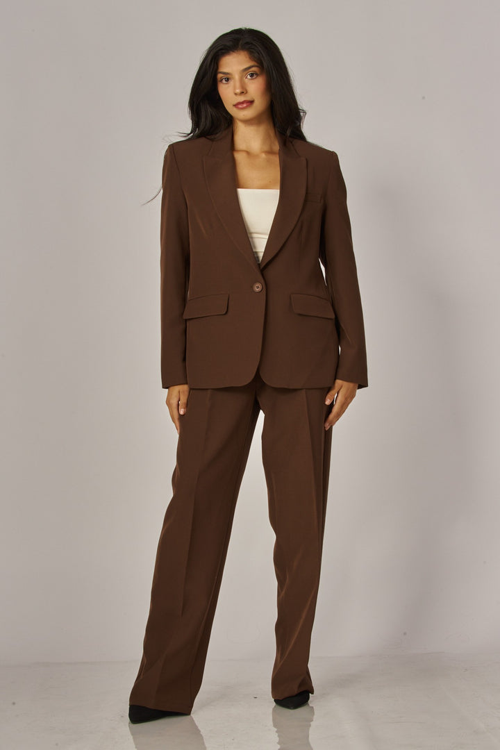 Full-length view of the espresso brown blazer with matching brown trousers and heels, a fall suit outfit