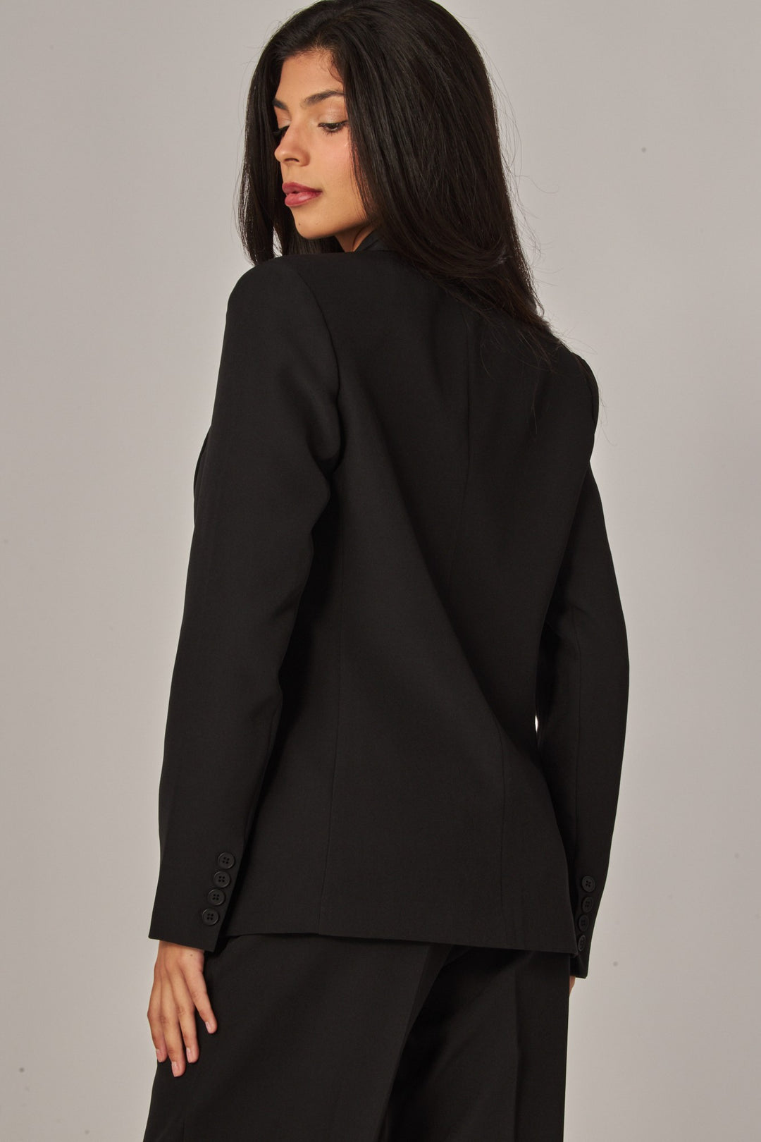 Back view of the black boyfriend blazer with long hair over the shoulder