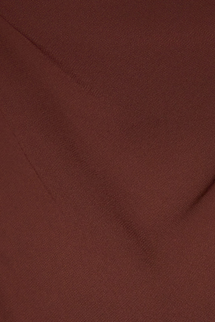 Close-up of the dark brown lightweight woven fabric of the cowl neck scarf top