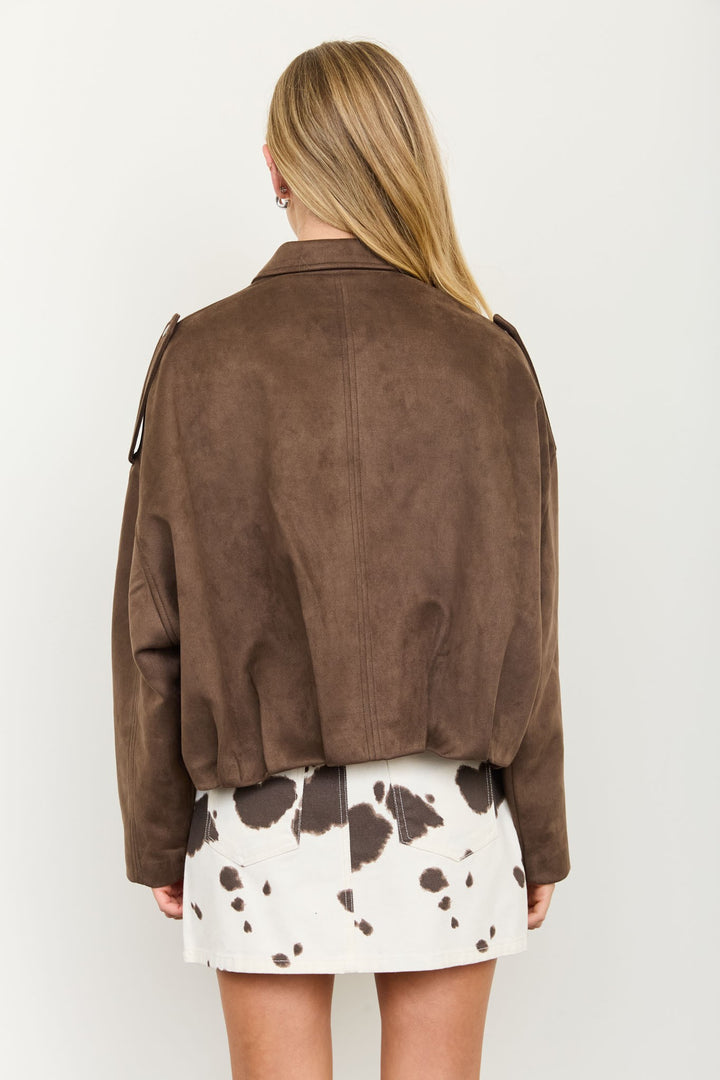 Back view of the Dark Brown Suede Cropped Jacket with shirt collar and cow print mini skirt