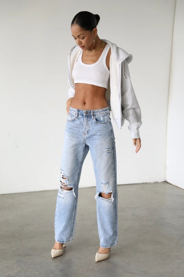 STYLED BY ALX COUTURE MIAMI BOUTIQUE Light denim straight jeans with ripped knees detail