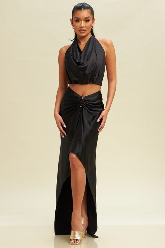 model is wearing Black Gold Trim Maxi Skirt Set with gold hoop earrings and gold heel sandals 