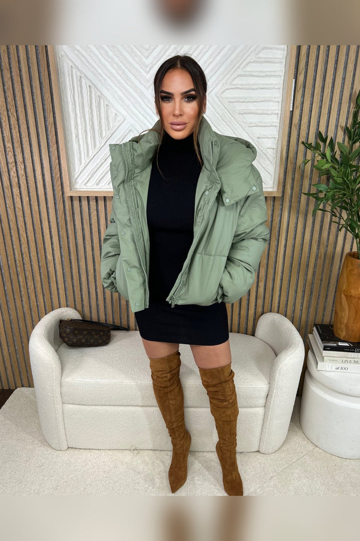 Buttery matte sage puffer styled for winter layering