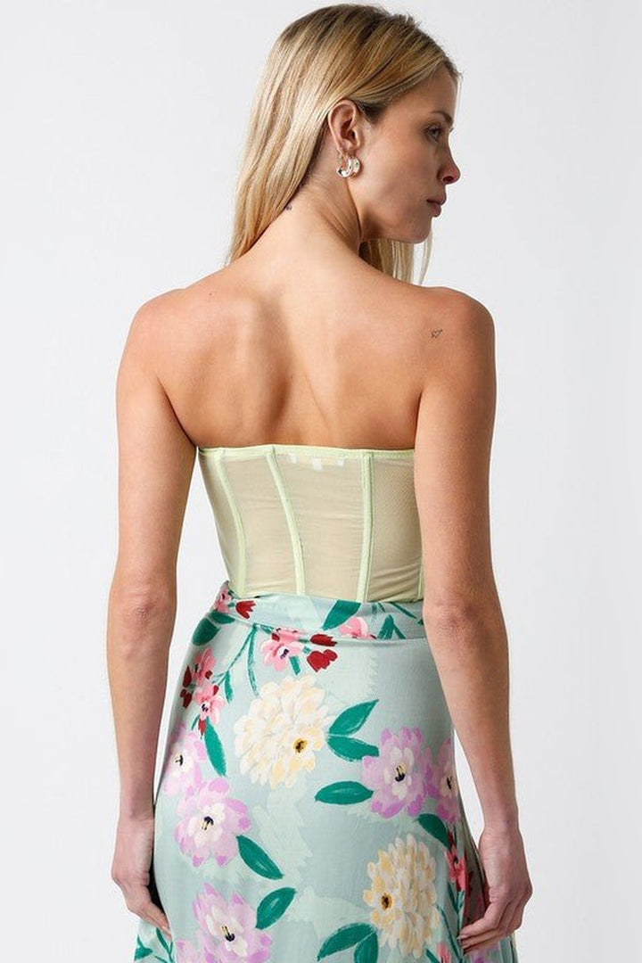 Honeydew green corset top with a shaped waist