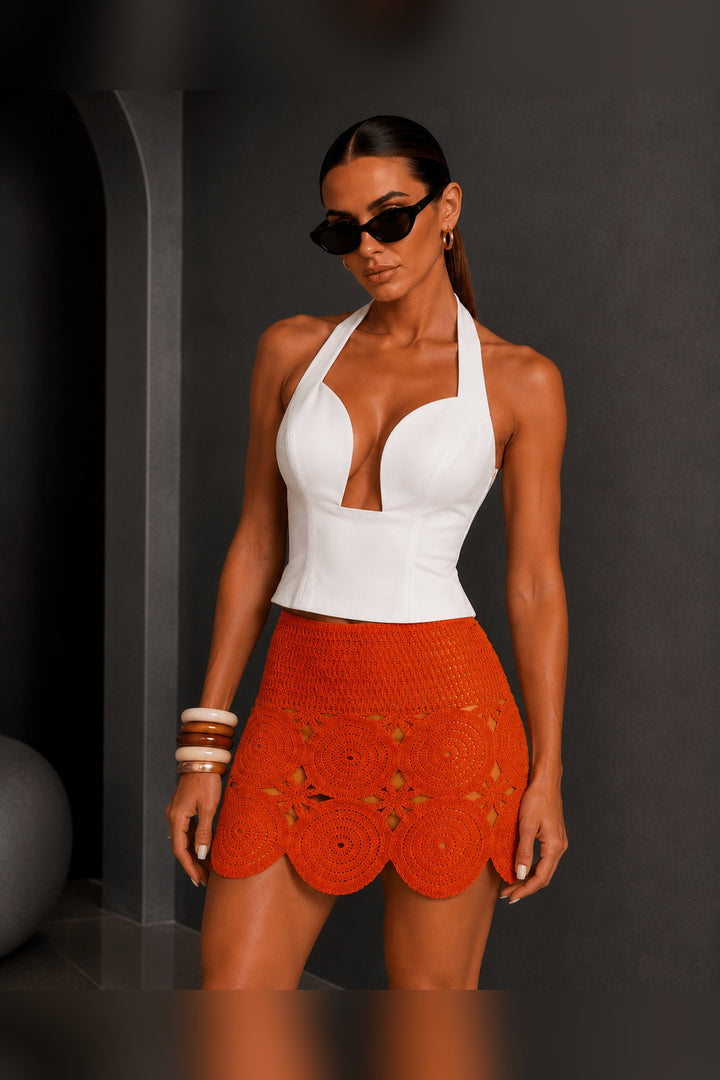 Stretchy woven waistband on a lined orange cotton crochet skirt