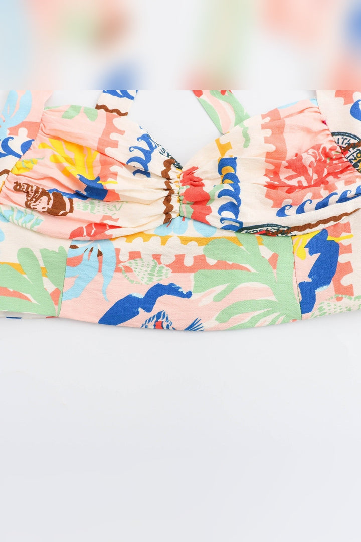 Sunshine yellow and pastel seaside print across a two-piece skirt set