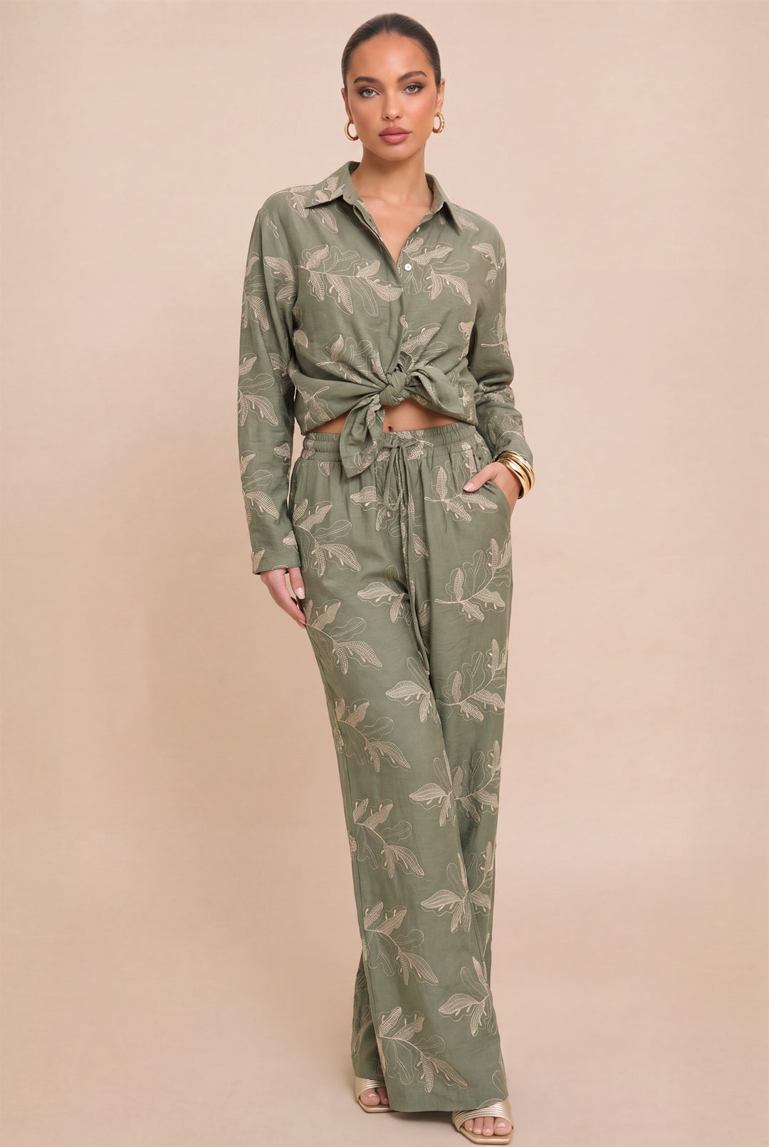 Front view of Luxxel olive embroidered shirt and wide-leg pants set, with the shirt tied at the waist