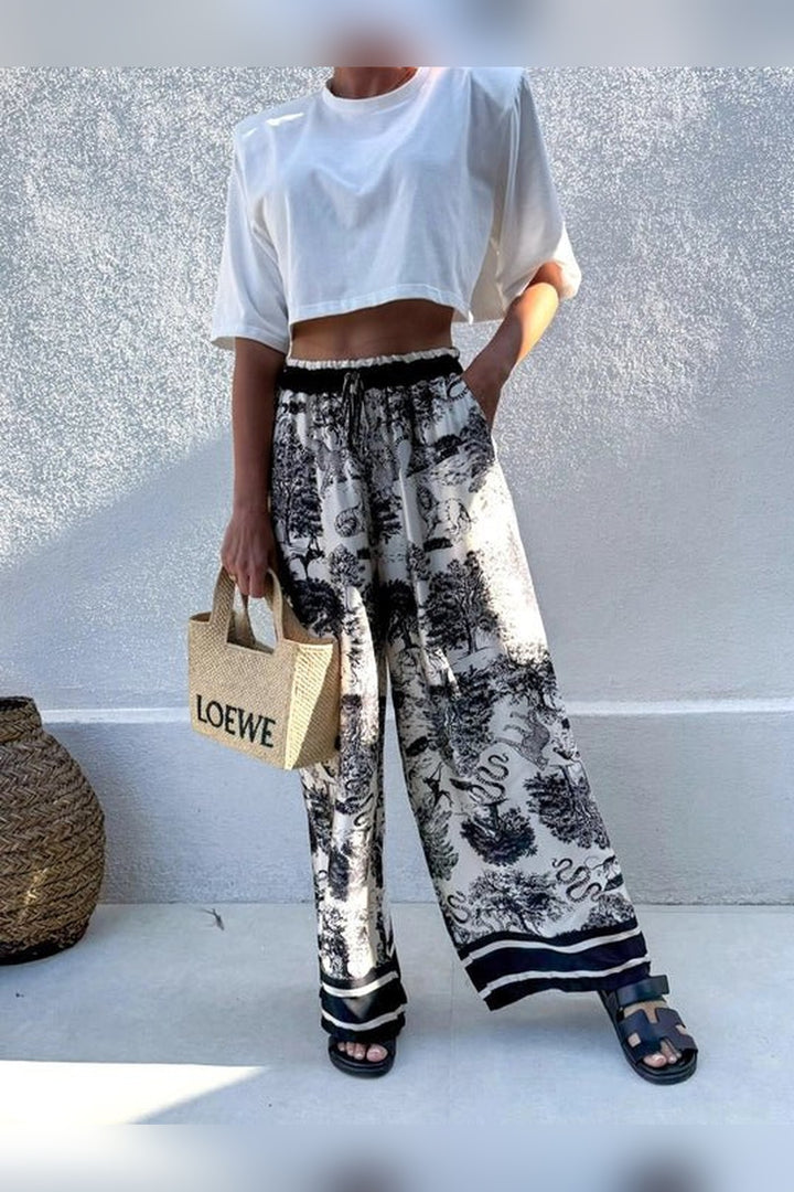 Wide leg black bohemian print trousers from STYLED BY ALX