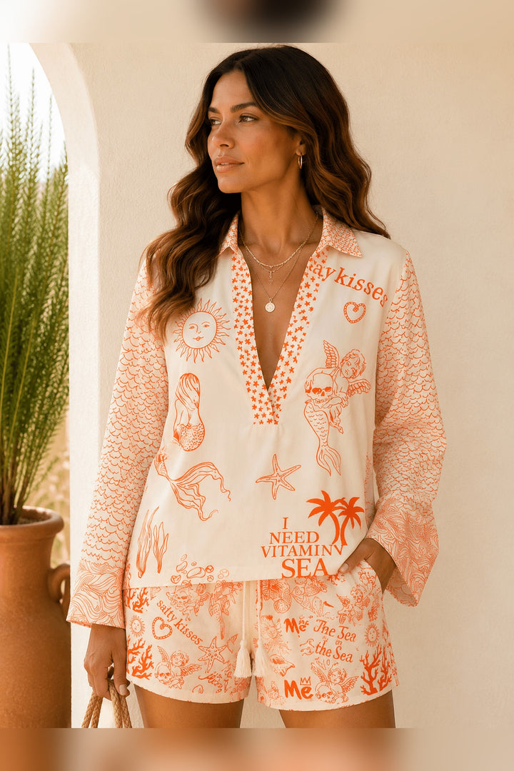 Orange woven two piece set with black and white mermaid print